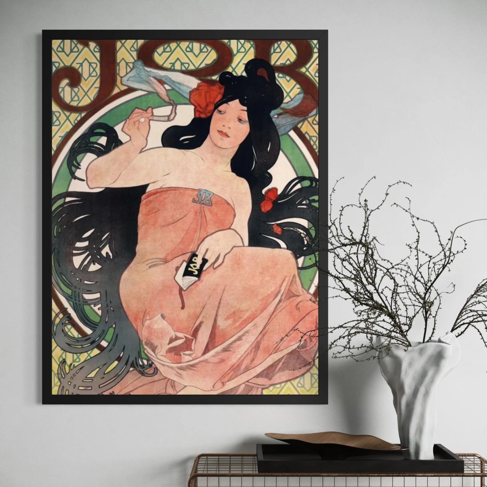 Framed JOB by Alphonse Mucha wall art hanging on a wall in a modern interior.