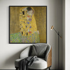 The Kiss by Gustav Klimt wall art hanging on a wall as elegant home decor.