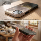 Ultra-thin ArtRelit Slim Case with classical art print in hand, showing precise camera lens protection.