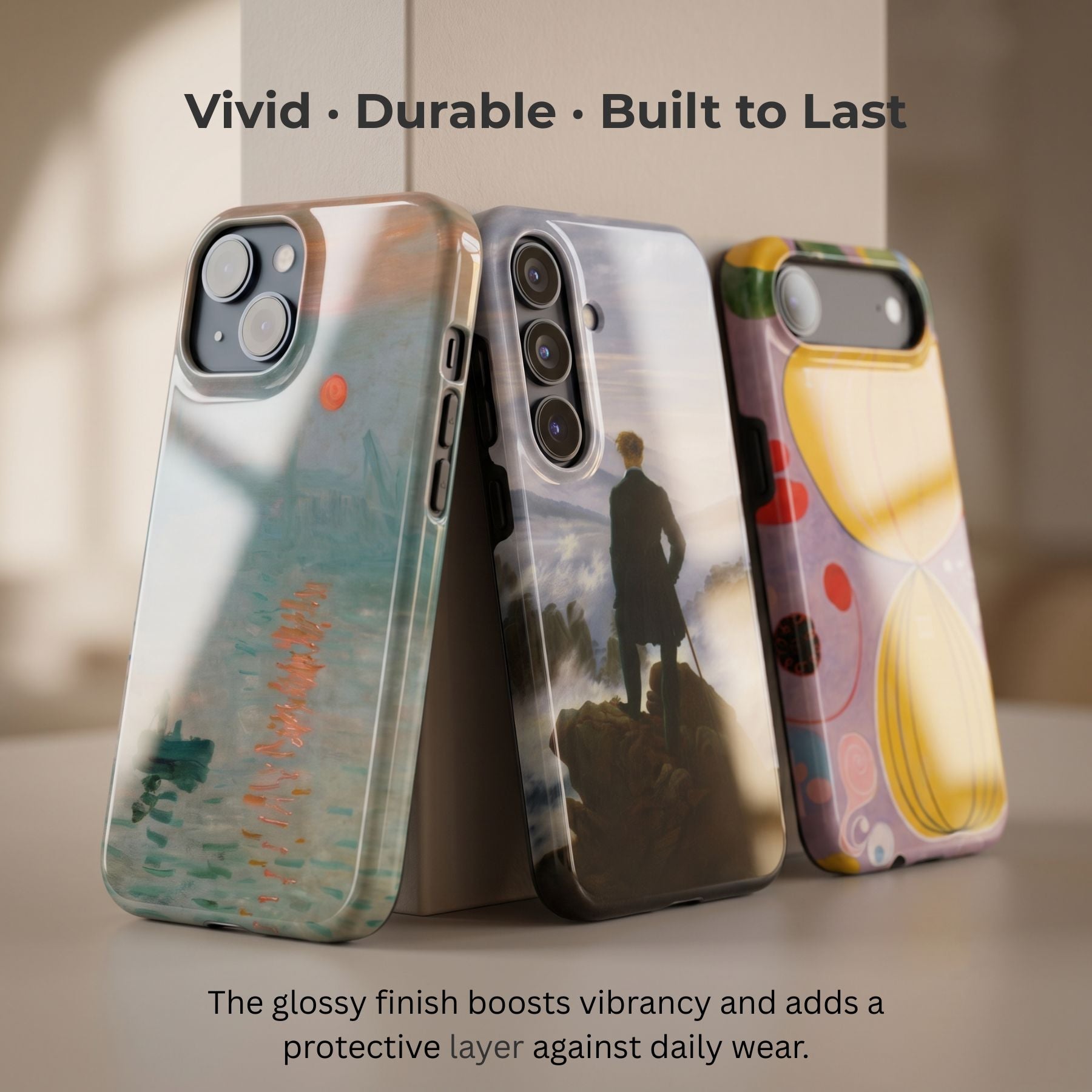 Glossy ArtRelit phone cases with vibrant art prints, showing the premium scratch-resistant finish.